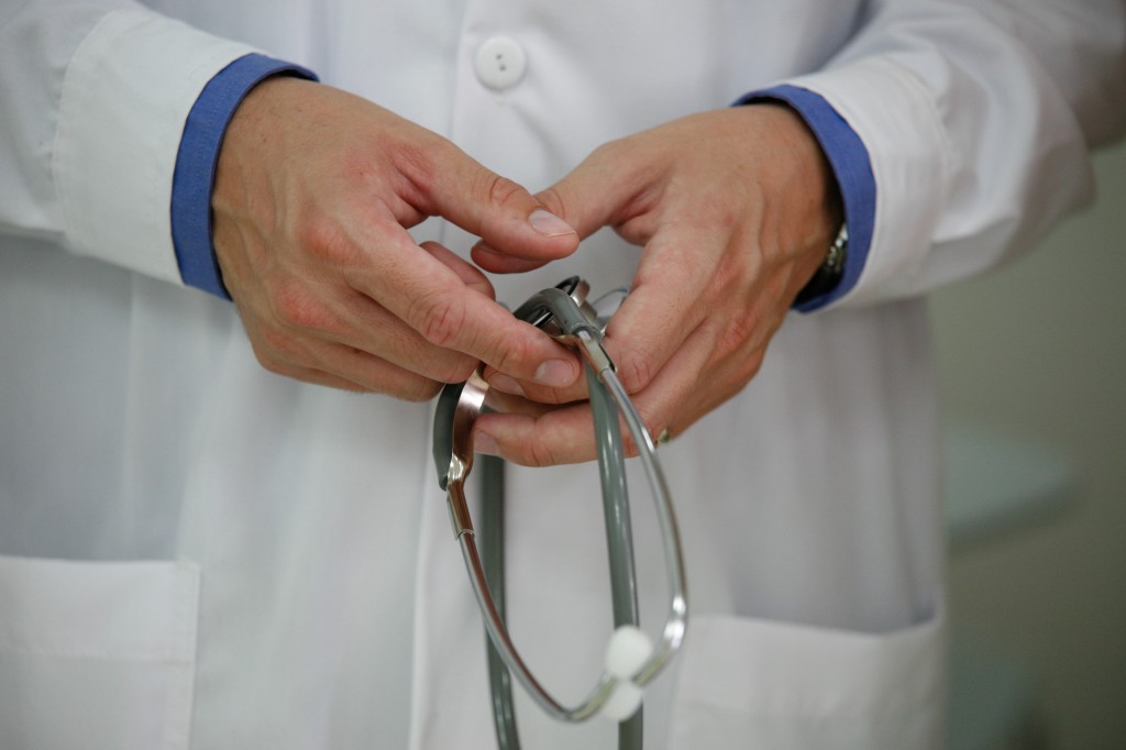 A doctor hold a stethoscope.