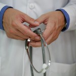 A doctor hold a stethoscope.